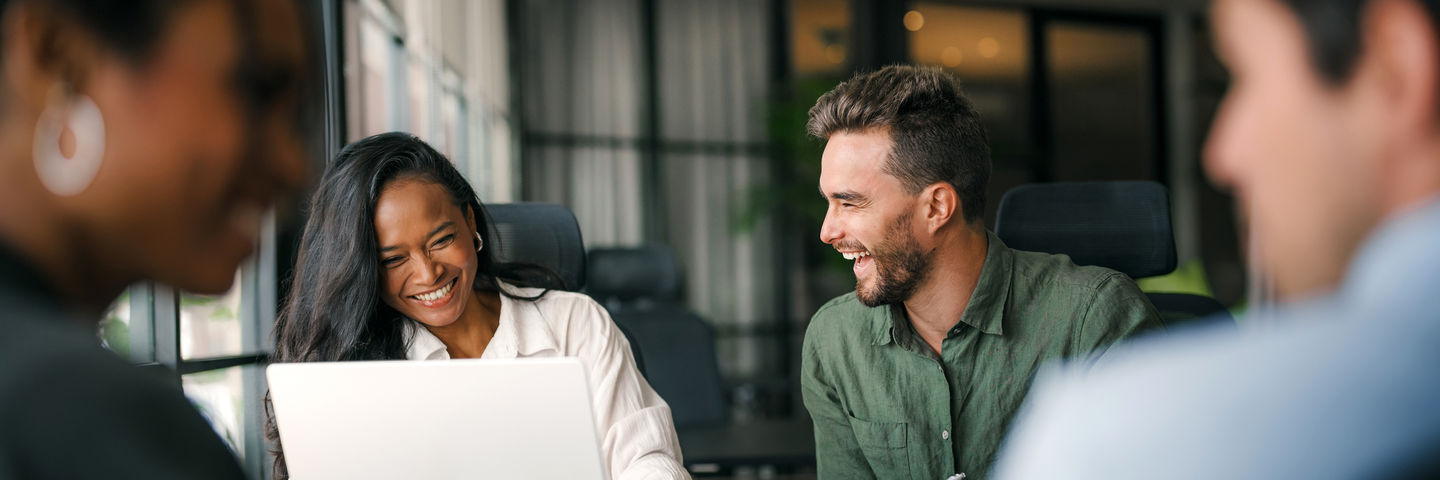 A diverse, talented team collaborates effectively in a bright office space during a business meeting. Creative group of successful coworkers working together